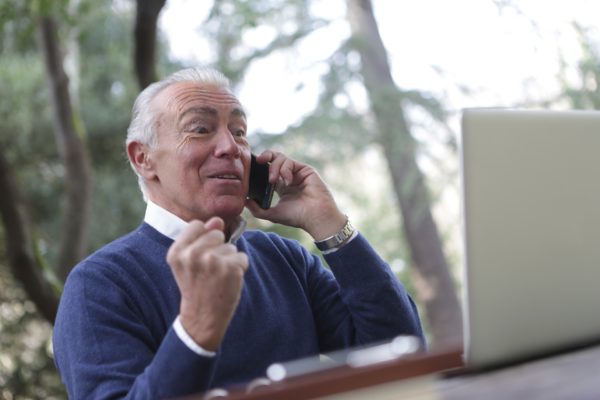 A middle aged man in a phone call